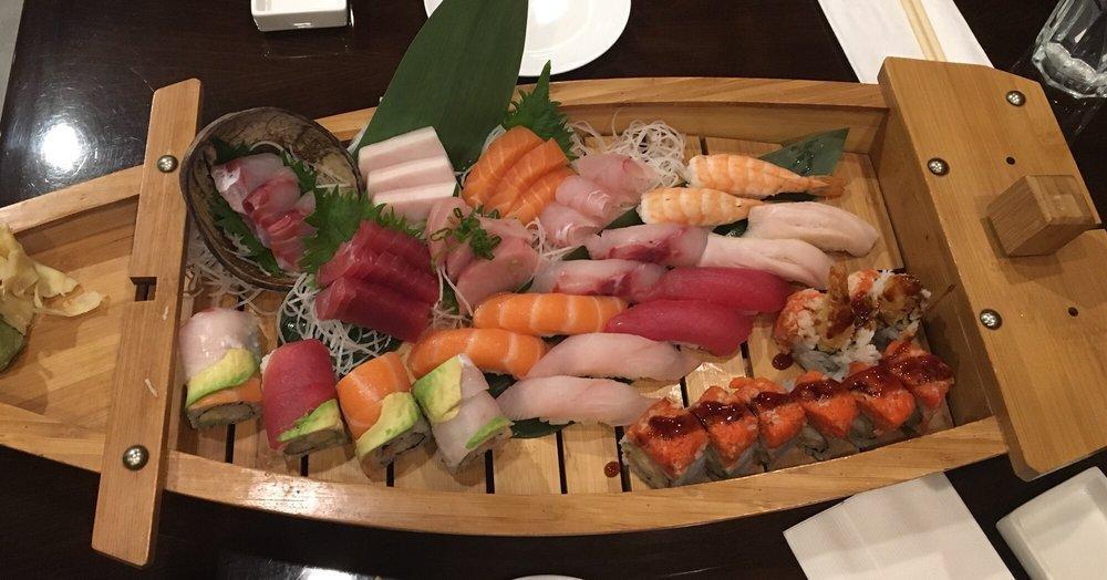 D10. Love Boat · 12 pieces sushi and 15 pieces sashimi, 1 rainbow roll and 1 dragon roll. sushi : 2 tuna,2 salmon, 2 fluke, 2 seabass, 2 yellowtail, 2 white tuna.  Sashimi: 3 tuna, 3 salmon, 3 yellowtail, 3 seabass, 3 white tuna , Served with miso soup and salad.