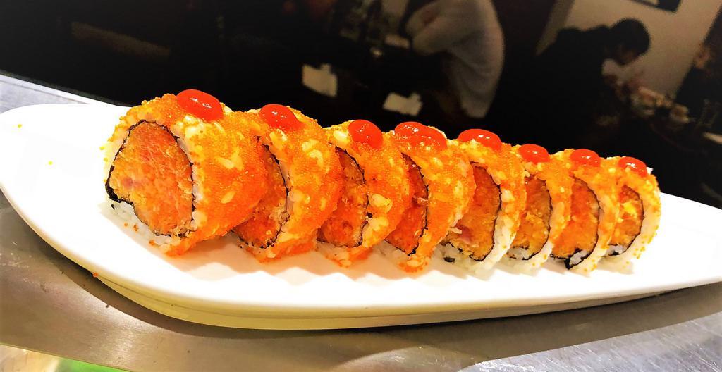 Volcano Roll · Spicy tuna, spicy salmon, spicy yellowtail, tobiko and spicy sauce on top.