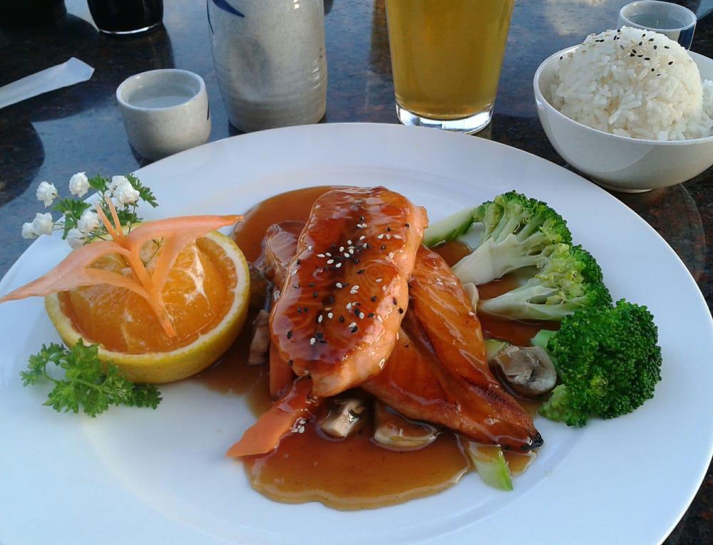 Salmon Teriyaki · Grilled Salmon, with stir fried onion on bottom. topped with  teriyaki sauce. 