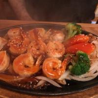 51. Shrimp Teriyaki · Served with rice and miso soup or green salad, marinated in a delicate teriyaki sauce.
