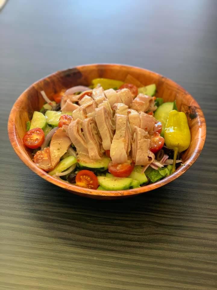 Chef Salad · Lettuce, tomato, black olives, cucumber, pepperoncini, turkey, ham and provolone.