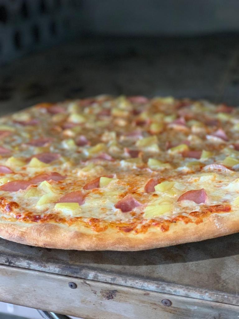 Hawaiian Pizza · Tomato sauce, mozzarella cheese, ham and pineapple.