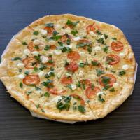 Margherita Pizza · Fresh Roma tomato, basil, Buffalo mozzarella with fresh garlic olive oil.