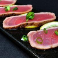 Blackened Tuna App · 10 pieces of lightly seared black pepper coated tuna drizzled with a delicious citrus ponzu ...