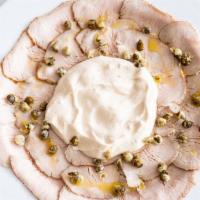 Vitello Tonnato · Thinly sliced roasted veal covered with creamy tuna sauce and fried capers