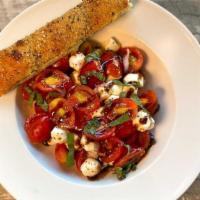 Queens Caprese · A perfect combination of tomatoes, fresh mozzarella, basil, olive oil, minced garlic and oni...