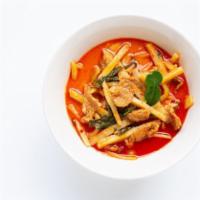 G2. Red Curry · Red curry paste with coconut milk, bamboo shoots, eggplants, bell peppers and basil.