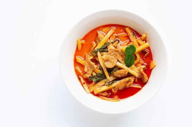 G2. Red Curry · Red curry paste with coconut milk, bamboo shoots, eggplants, bell peppers and basil.