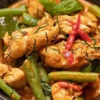 G4. Pa-Nang Curry · Pa-nange curry paste with coconut milk, green beans, bell peppers and basil.