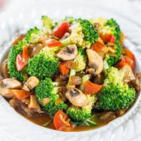 P8. Pad Mixed Vegetables · Stir fried broccoli, onions, cabbage, carrots, green beans and mushroom in garlic sauce.