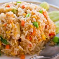 R1. Fried Rice · Served with egg, onions, tomatoes and mixed carrots and peas.