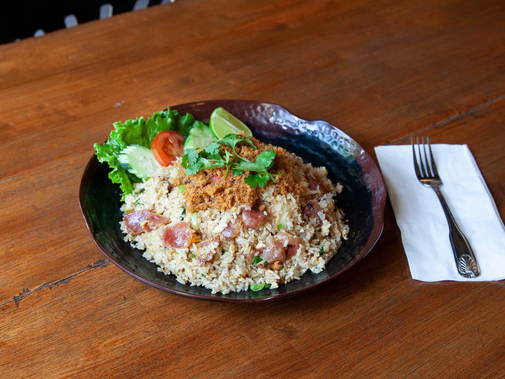 R5. Thai Sweet Sausage Fried Rice · Fried rice with our Thai special sweet sausage from Thailand with egg, tomatoes, onions and cilantro topped with dried seasoning flossy pork.