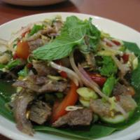 Y2. Yum Nuar Salad · Beef salad. Spicy salad of Eastern Thailand with grilled beef, lime juice, chilies, onion, s...