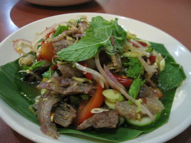 Y2. Yum Nuar Salad · Beef salad. Spicy salad of Eastern Thailand with grilled beef, lime juice, chilies, onion, scallion, cilantro, cucumbers and tomatoes served on a bed of lettuce.