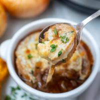 Guinness French Onion Soup · Guinness caramelized onions and sweet vermouth, oven baked croutons topped with cheese.