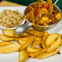 Irish Chicken Curry · Sauteed chicken breast, peppers and white onions in Irish curry sauce, served with rice pila...
