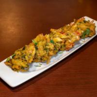 Paneer Pakora · Deep fried marinated paneer dipped in chickpea flour, battered with Nepali herbs and spices.