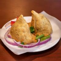 2 Piece Meat Samosas · Light spicy turnovers stuffed with minced lamb and spices.