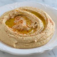 Hummus · Minced chickpeas with tahini, lemon and olive oil.
