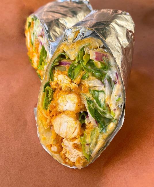 Buffalo Chicken Wrap · Fried Chicken tossed in Buffalo Sauce, Romaine lettuce, Red Onion and Blue Cheese Dressing