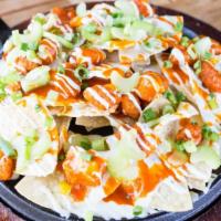 Buffalo Hot Nacho · Popcorn chicken breast tossed in buffalo hot sauce, white queso, ranch dressing, celery & gr...