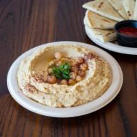 Hummus and Pita Bread · Dip made from chickpeas and round whole wheat flatbread. 