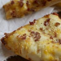 Loaded Bacon Breadsticks · Served with bacon, cheddar, pizza cheese and seasoning.