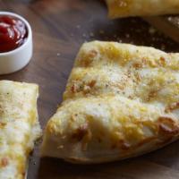 Cheese Breadsticks · Served with cheddar, pizza cheese and seasoning.
