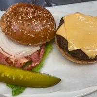 cheese burger · 1/2 pound 100% beef with garnish on a seeded bun.