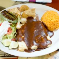 Enchiladas de Mole · 3 soft rolled tortillas filed with choice of meat cover with melted cheese and mole sauce.  ...