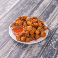 S16. Popcorn Chicken · Perfectly snackable fried chicken bites served with sweet-n-sour sauce.