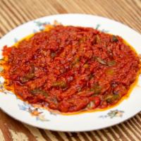 Matbucha · dip made from spicy stewed tomatoes, hot peppers, garlic & spices
