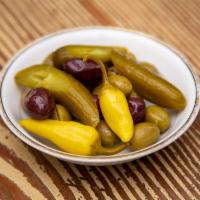 Olives and Pickles · marinated olive medley, pickled cucumbers, & pickled hot peppers