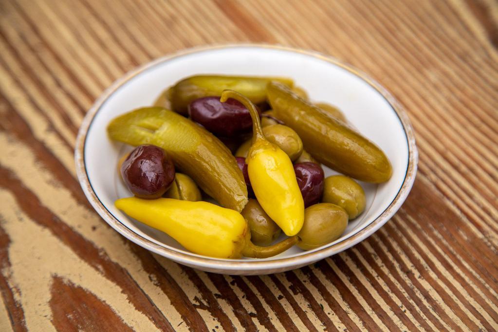 Olives and Pickles · marinated olive medley, pickled cucumbers, & pickled hot peppers