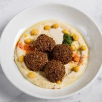 Hummus and Falafel Platter · with spicy green schug, tahini, & chickpeas