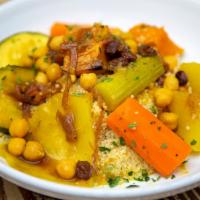 Vegetable Couscous · braised butternut squash, carrots, zucchini, celery, turnips, served over a bed of fluffy co...