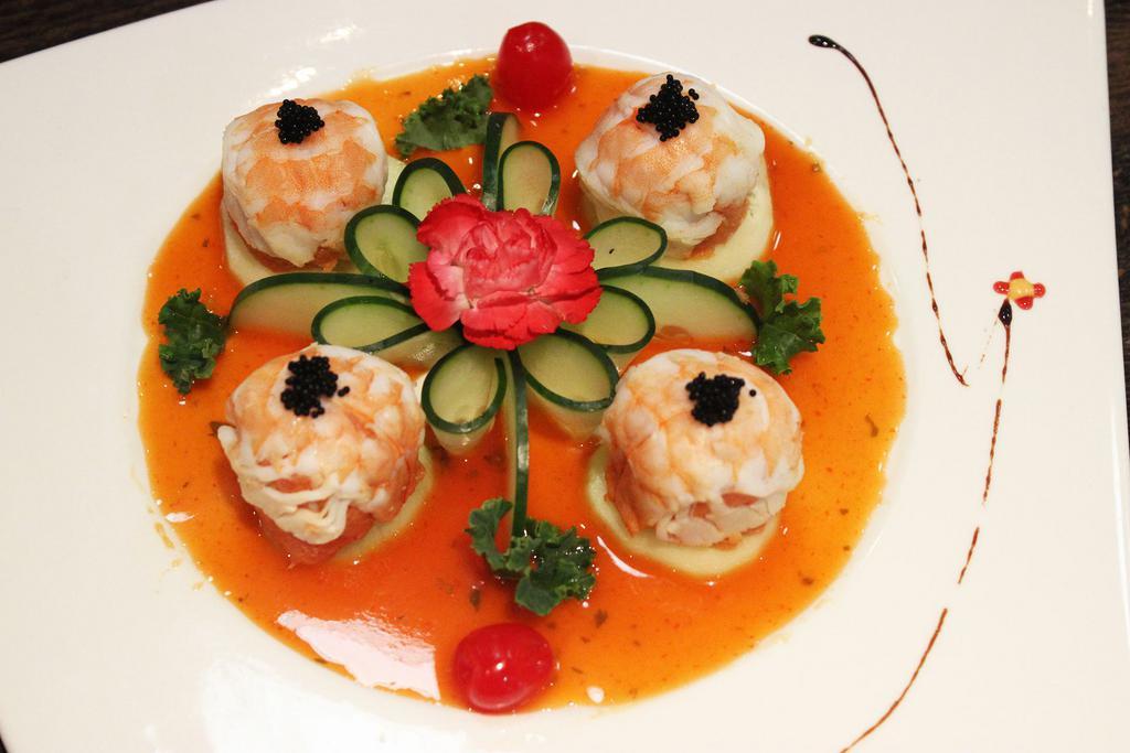 9. APP Dragon Ball · Spicy tuna inside and steamed shrimp on top chef special sauce.