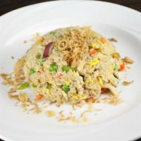 2. Thai Fried Rice · Fried rice with egg, onion, bell peppers, basil, peas, carrots  and topped with fried onion....