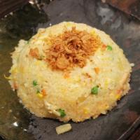 6. Pineapple Coconut Fried Rice · Tian mu fried rice with pineapple, egg, carrot, green beans, coconut milk, topped ground pea...