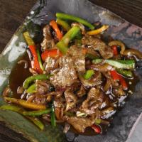 8. Mongolian Beef · Stir fried beef with scallion, onion and garlic with chef's special sauce. Served with tom k...