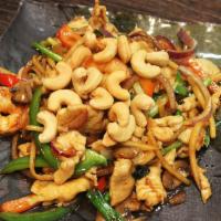 11. Basil Cashew Delight · Stir fried chicken and jumbo shrimp with basil, mushroom, bamboo shoots, bell pepper, onion ...
