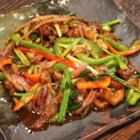 12. Spicy Basil Duck · Stir fried roasted duck, basil, bell pepper, onion and scallion. Served with tom kah kai sou...