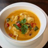 18. Panang Panang Curry · Panang curry with basil, onion, potatoes, bell pepper and coconut milk. Served with tom kah ...