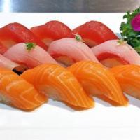 Triple Color Sushi · 4 pieces of each tuna, salmon and yellowtail.