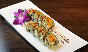7. Chesapeake Superman Roll · Lump crab, fresh salmon, avocado, cream cheese inside, deep fried with eel sauce and spicy m...