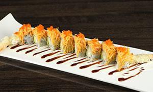 10. Dancing Dragon Roll · Shrimp tempura and avocado inside and spicy crabmeat on the top.
