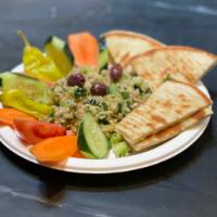 Tabouli Salad · Bulgur wheat, green onion, parsley, tomato, cucumber, lemon juice and olive oil.