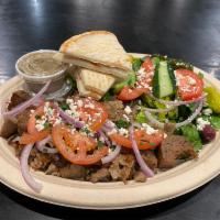 Gyros Plate · Lamb and beef gyros served with a side Greek salad and side pita.