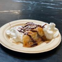Baklava · Phyllo dough, cinnamon, walnuts and honey topped with chocolate syrup.