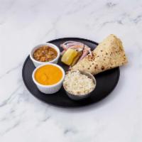 Amritsari Thali · Stuffed kulcha, chana, and paneer curry with rice and salad.